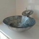 Tempered glass sink and faucet set with a brick pattern vessel basin and a waterfall tap